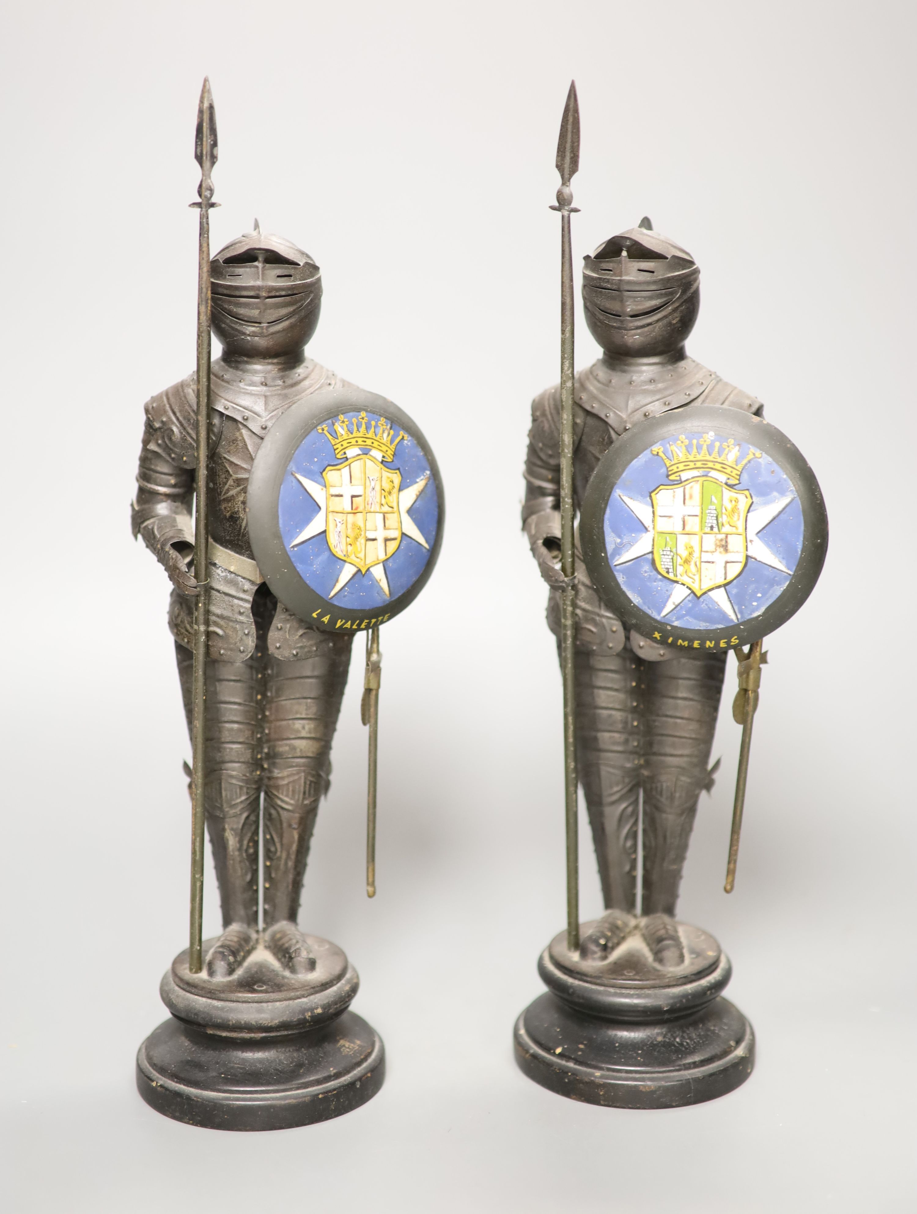 A decorative pair of tin model Maltese knights, height 31cm